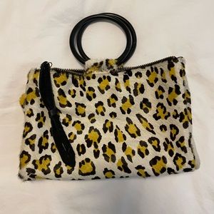 Clutch with leopard print fur and metal handles